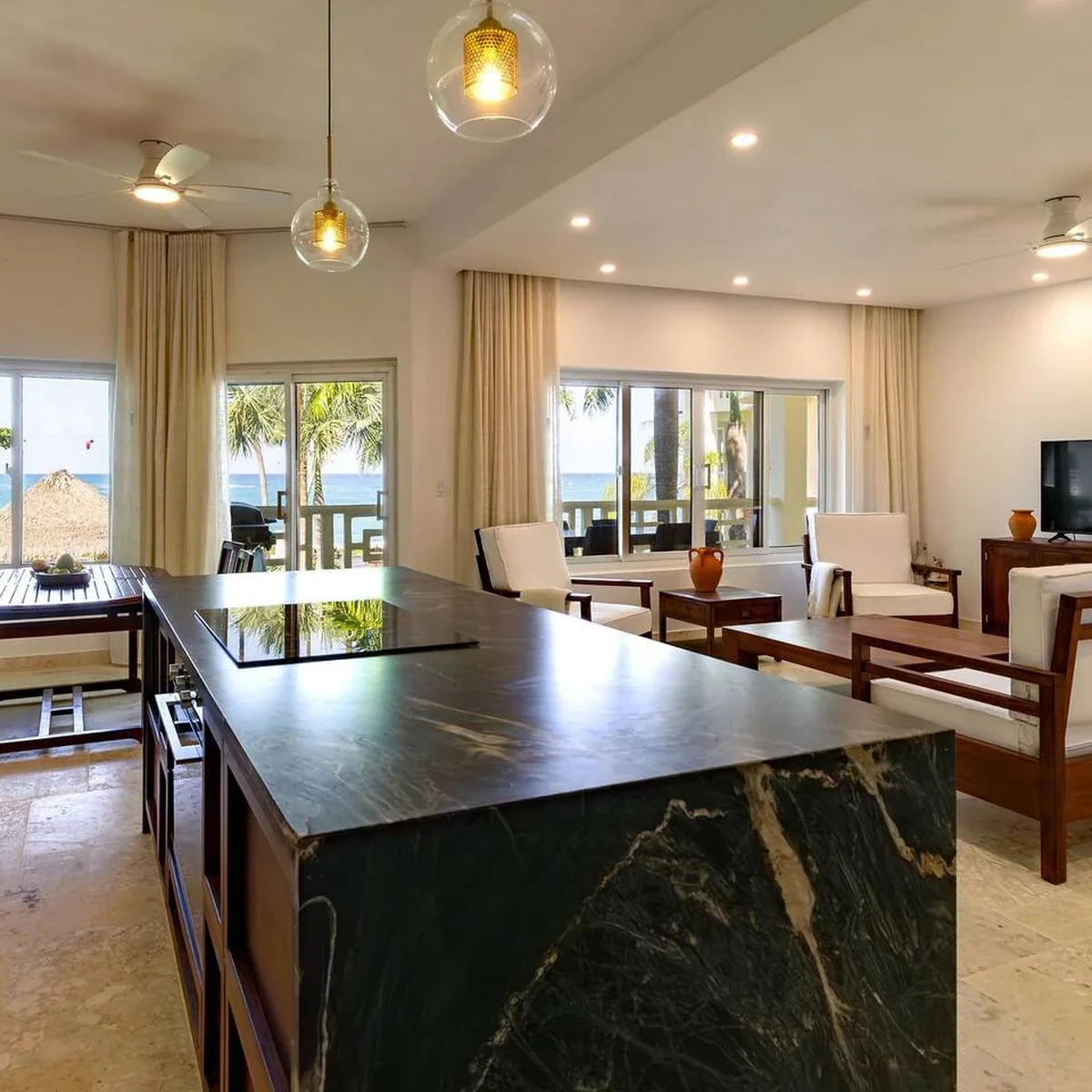 Completed open-plan living, dining and kitchen space in the Cabarete apartment