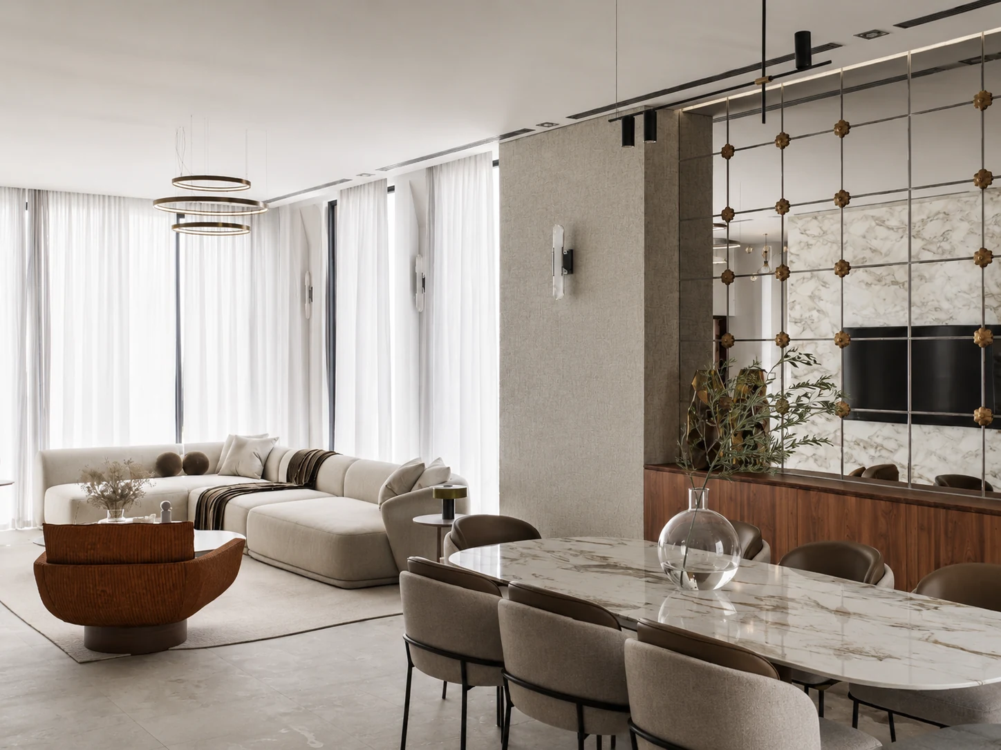 Living and dining spaces connected through one material palette